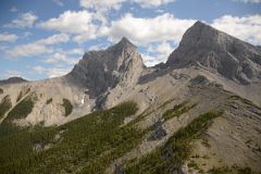12C Two Of The Three Sisters - Charity Peak and Hope Peak From Just After Three Sisters Pass As Helicopter From Lake Magog Nears Canmore In Summer